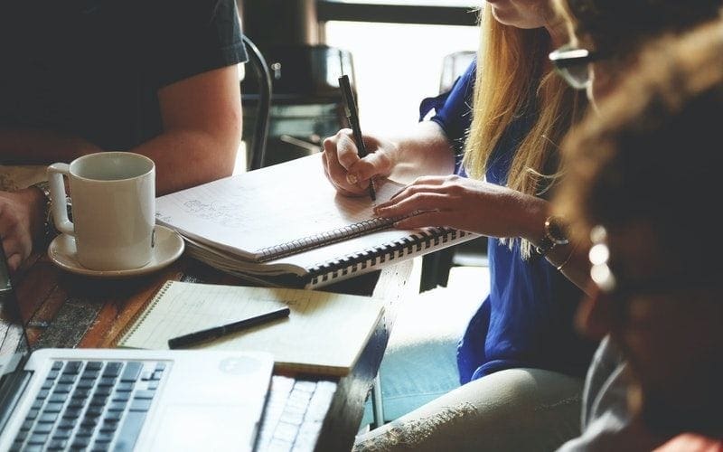 group of people writing