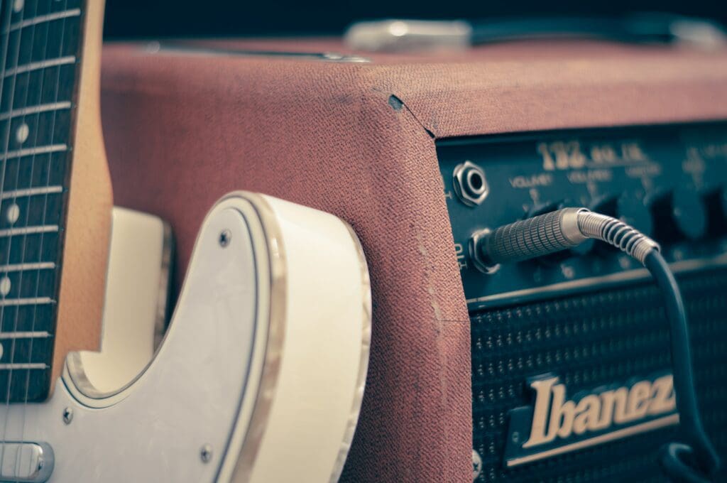 guitar next to an amp