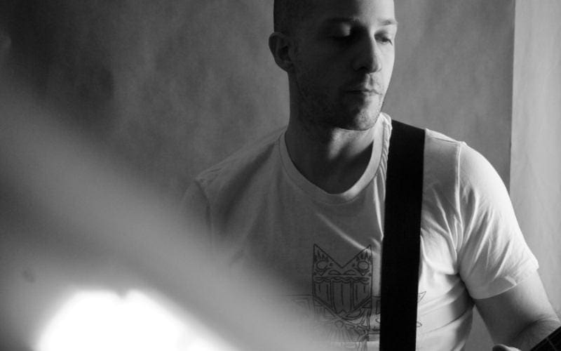 Man playing guitar black and white for his EPK