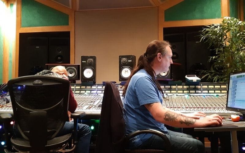 Man at mixing desk inside RAK Studios
