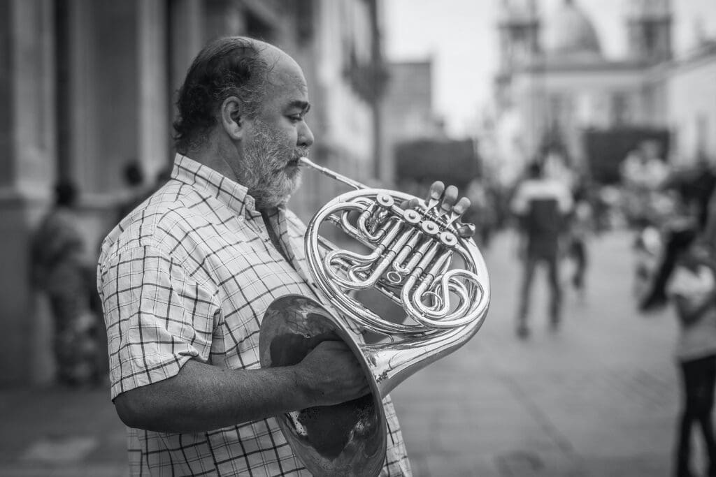 man playing French horn