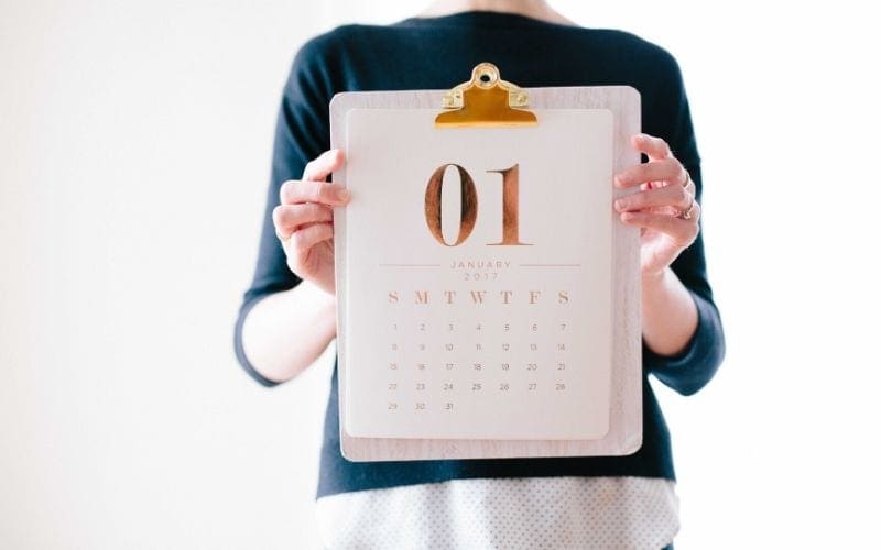 Women holding up calendar